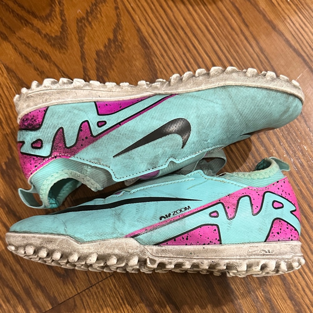 Nike Zoom Turf cleats in Teal and Pink